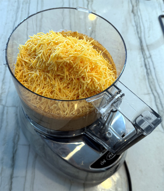 Add the cheese and process just until combined, another minute.