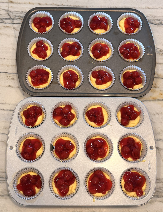 Spoon about 1 Tbsp. of cherry pie filling onto the center of each muffin, using the whole can. 