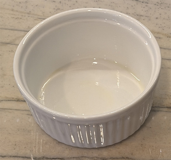 Grease a ramekin with the avocado oil and set aside.