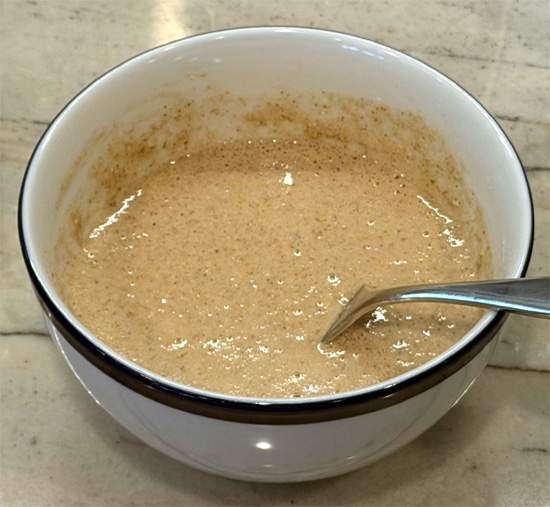 Using a fork, mix in fat-free milk, vanilla extract, and sugar-free maple syrup until just combined. Pour batter into the prepared ramekin.