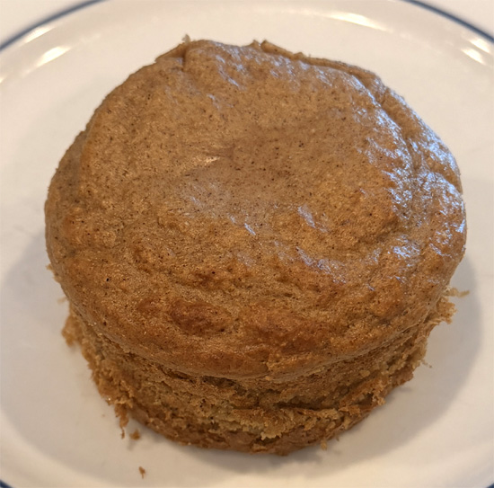 Let the muffin cool for 5 minutes. Run a knife around the edges and turn it out of the ramekin. Spoon topping over the muffin and serve.