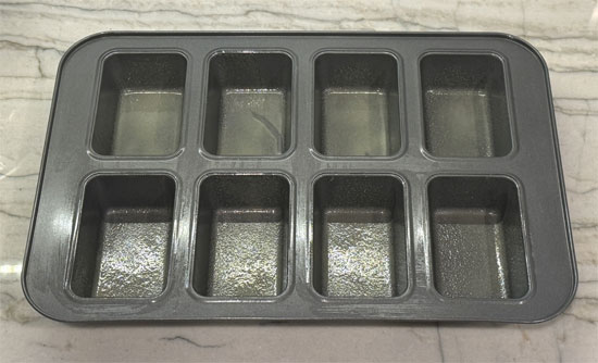 Lightly coat a mini loaf pan (8 trays) with avocado oil or buttery cooking spray. Set aside.
