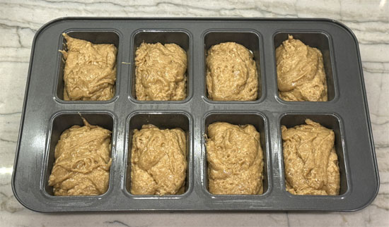 Divide the mixture evenly between the 8 trays of the mini loaf pan. Then bake for 30 minutes at 350 degrees Fahrenheit. 