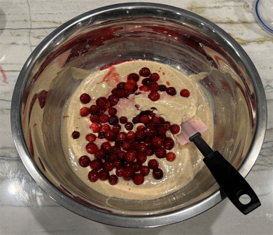 Fold the thawed cranberries into the mixture. 