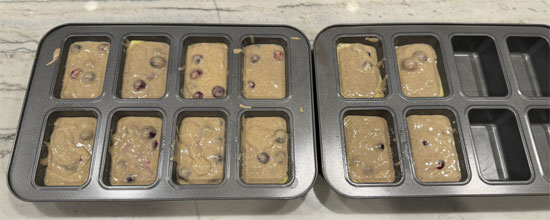 Divide the mixture evenly between the 12 trays, about 1/2 a cup per tray.