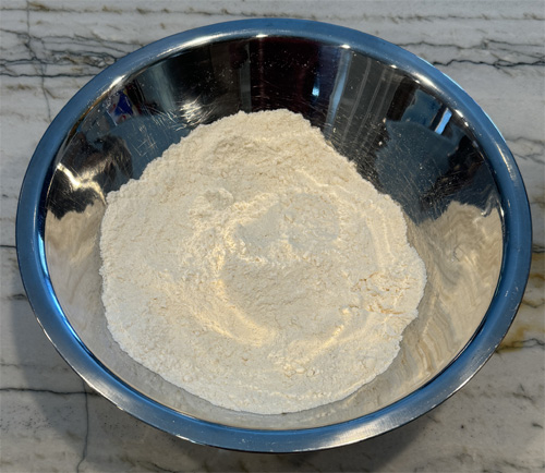 Whisk together the cake mix and protein powder in a large mixing bowl.