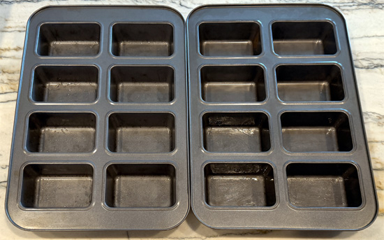 Lightly grease 12 mini loaf pans with avocado oil.