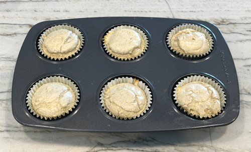 Divide the mixture between the 6 cupcake liners. Then, put them in the oven to bake for 12-15 minutes. DON'T OVERCOOK. They're done when a toothpick inserted into the center of a muffin comes out clean. 