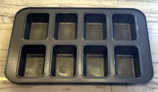 Spray the trays of an 8-mini-loaf baking pan with fat-free cooking spray. Set aside.