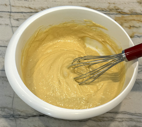 In a large mixing bowl, combine the next seven ingredients: cake mix, root beer, root beer extract (if you have it), oil, egg whites, whole egg and protein powder.