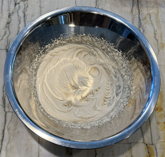 Get the cold, sugar free root beer and combine it with a packet of Dream Whip in a metal or glass bowl. Beat it with a mixer for 2-3 minutes until soft peaks form.