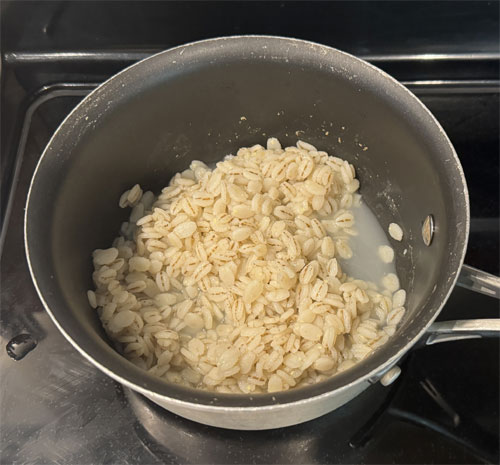 Add the barley, bring back to a boil, then reduce heat to low. Stir, cover and cook on low for 35-40 minutes or until most of the liquid is absorbed. 