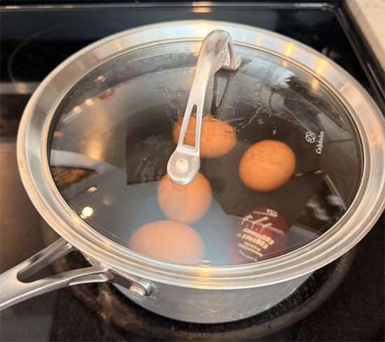 Hard boil the eggs: Place 2 large eggs in a pot with 4 cups of cold water. Bring to a boil over high heat, then remove from heat and cover. Let sit for 12–14 minutes, then transfer eggs to an ice bath for 10 minutes. Peel, chop, and set aside. 