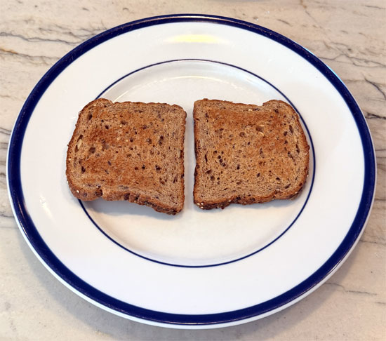Toast the 2 slices of bread. 