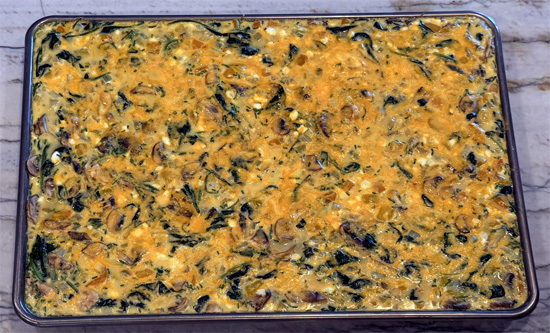 Pour everything into the prepared pan and sprinkle cheese over the top. Bake 18 to 22 minutes, until the center is set.
