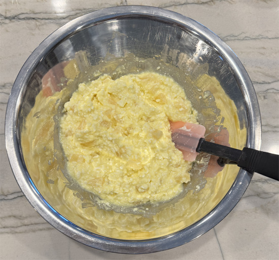 Fold in drained pineapple tidbits.