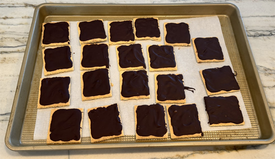 Assemble sandwiches: Remove crackers from freezer. Divide the Cool Whip mixture evenly among the 10 chocolate-covered crackers.