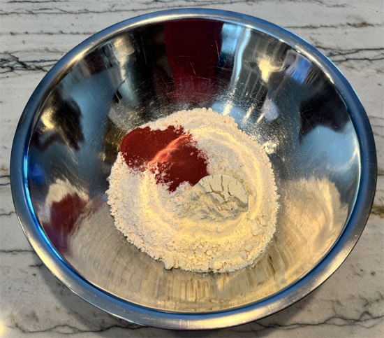 Mix the dry ingredients: In a large bowl, whisk together your cake mix, sugar-free Jell-O powder (orange or raspberry), and protein powder until well combined and evenly colored.