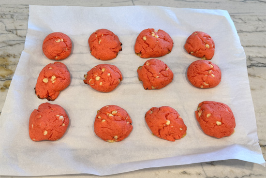 Slide the whole sheet of parchment paper (with cookies) off onto your counter. Let the cookies rest for 10 minutes; they’ll finish setting up as they cool.