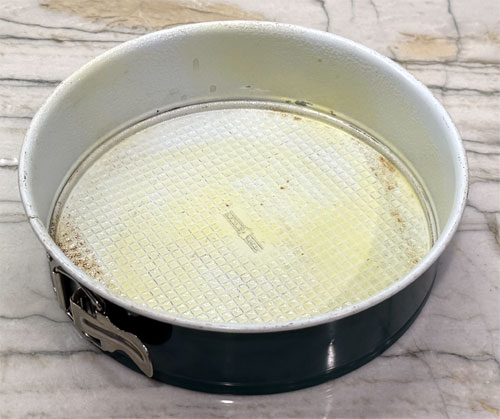 Lightly coat the bottom and sides of a springform pan with buttery spray. 