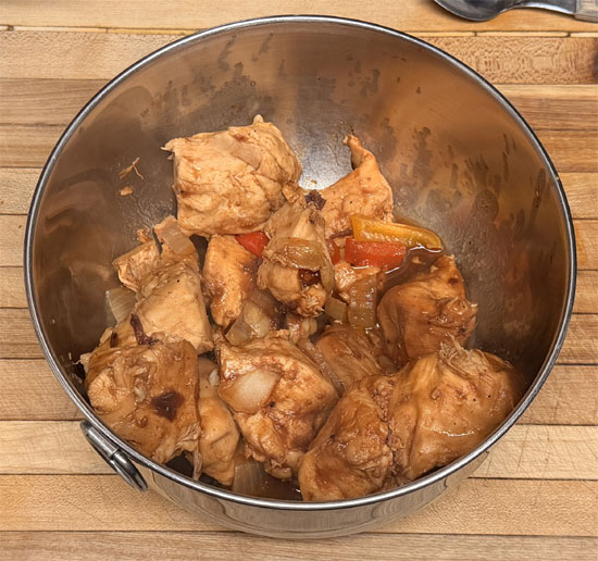 While quinoa is cooking, remove chicken from slow cooker and shred with two forks. Return shredded chicken to pot and stir into sauce.