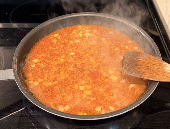 Pour in the beef broth, tomato sauce, and water. Increase heat to high and bring to a boil, stirring occasionally.