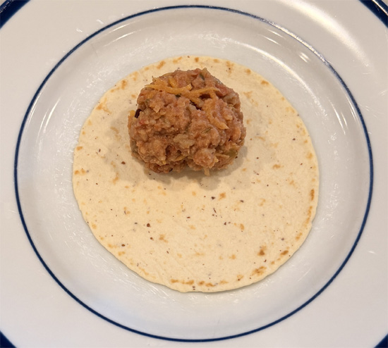 Spoon about 1/3 cup of filling onto each tortilla. Fold in the sides, then roll up tightly.