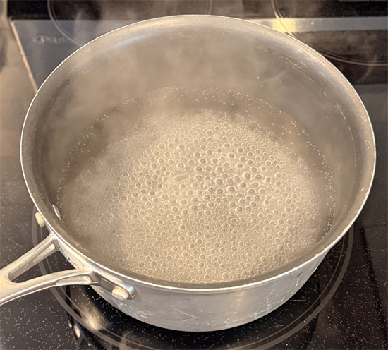 Fill a medium pot halfway with water, add 1/4 teaspoon of salt and set it over high heat.