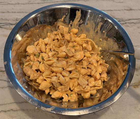 Combine the chicken and pasta in a large bowl, pour the cheese sauce over the top, and mix until everything is coated.