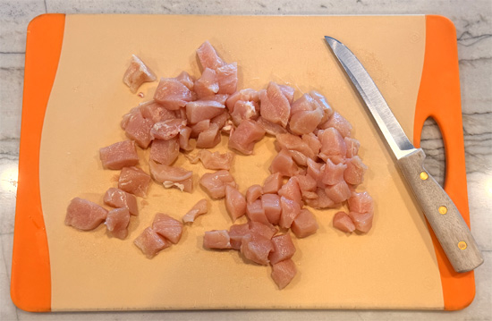 Pat the chicken dry and cut it into bite-sized pieces.