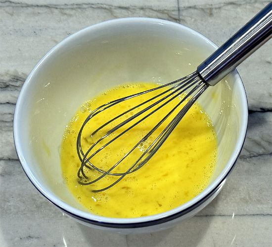 Prepare the Meatball Mixture: In a large bowl, combine the panko bread crumbs, yogurt, garlic, scallions, oregano, crushed red pepper, paprika, black pepper, and salt. Whisk the eggs together and put them in the mix. Add the ground chicken and mix until fully combined.