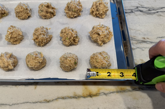 Shape and Bake the Meatballs: Form the mixture into 26 meatballs, about 2 inches wide each. Place them on the baking sheets and bake in the preheated oven for 20 minutes or until the internal temperature reaches 165°F.