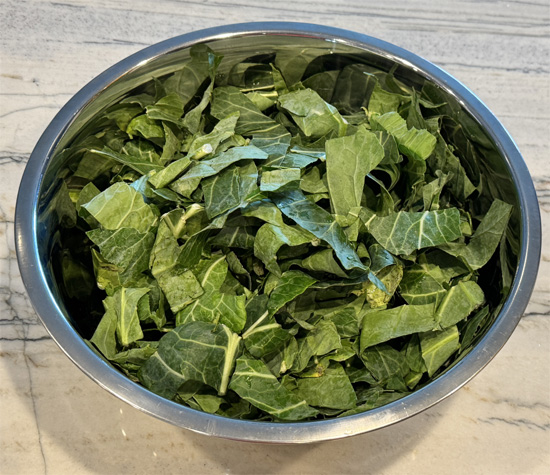 Prepare the Collard Greens: In a large bowl, toss the chopped collard greens with the cumin, sliced lemon, and lemon juice. Lightly spray with olive oil to coat.