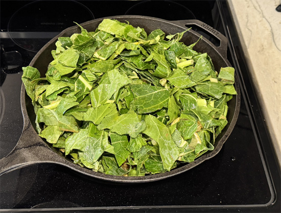 Cook the Collard Greens: Heat a large frying pan (at least 12 inches across) over medium heat. Add the collard greens to the pan, then pour the broth over them. Cook for 9-10 minutes, stirring occasionally, until the greens are tender.