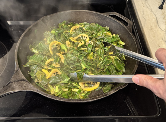 Cook the Collard Greens: Heat a large frying pan (at least 12 inches across) over medium heat. Add the collard greens to the pan, then pour the broth over them. Cook for 9-10 minutes, stirring occasionally, until the greens are tender.