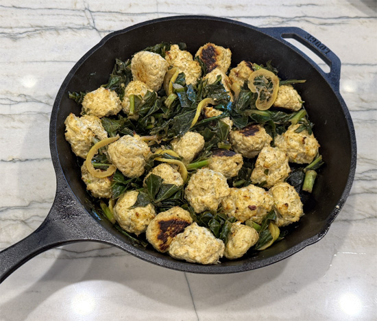 Combine the Meatballs and Greens: Once the meatballs are done, add them to the pan with the collard greens and gently mix everything together. Squeeze the juice from a lemon over the top and mix it in.