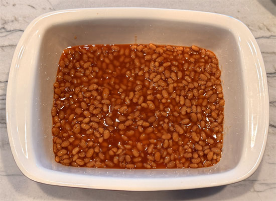 Spread 2 cups (about two-thirds of the can) of baked beans along the bottom of a 9 x 13 baking dish. 