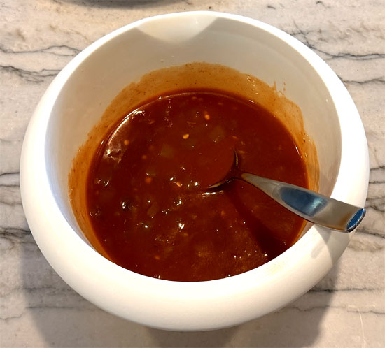 In a small bowl, mix together the enchilada sauce and green chiles. 