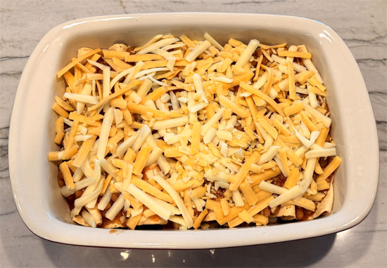 Top everything with the shredded cheese. 