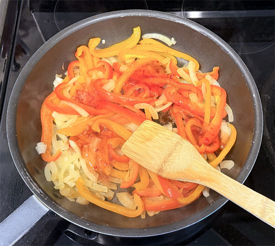Stir in the sweet chili sauce, then cover and cook for another 4 to 6 minutes, stirring occasionally, until the peppers soften. 
