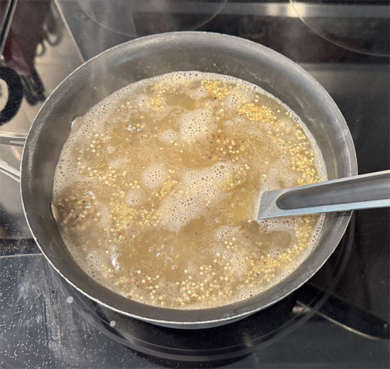 Cook quinoa: In a medium pot, bring chicken broth, 1 tsp olive oil, and 1/4 tsp salt to a boil. Add quinoa, reduce heat to low, cover, and simmer 15 minutes.