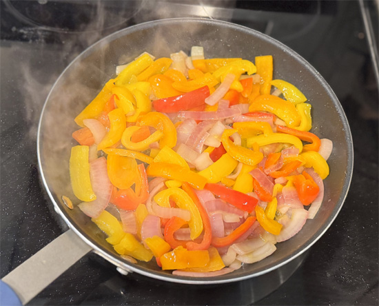 Add wine: Pour in ouzo or wine and simmer 2-3 minutes to cook off alcohol.