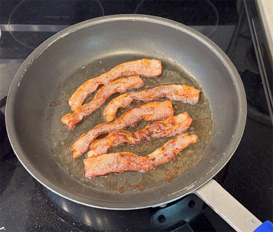 Heat a large skillet over medium-high heat and cook the chopped bacon until browned and crispy, about 5-7 minutes. Place the cooked bacon on a paper towel-lined plate. Set aside to cool.