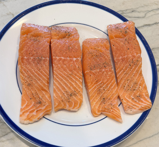 Season the salmon. Pat fillets dry, then sprinkle with salt and pepper. Set aside.