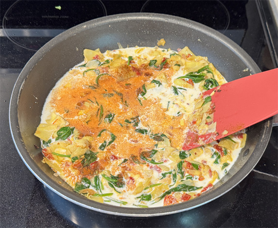 Stir in half and half and smoked paprika. Season lightly with salt and pepper.