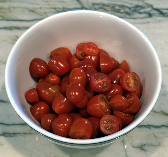 As soon as the beef is no longer pink (but not yet browned), stir in the tomato paste. Add the halved tomatoes and cook until the tomatoes start to fall apart and beef browns, about 5 more minutes. 