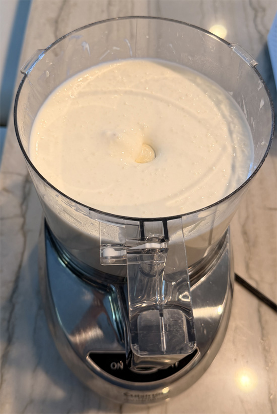 In a blender or food processor, combine cottage cheese, parmesan, and water. Blend for 2-3 minutes until smooth. Set the cheese sauce aside. 