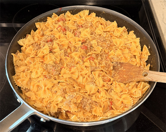 Stir in the cooked pasta. Mix well and cook for another 2-3 minutes until everything is hot. Serve immediately. 