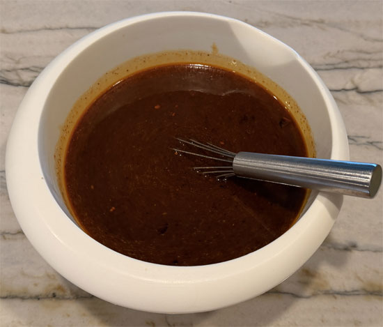 Pour the boiling water over the spice mixture and stir to combine. Pour this evenly over the chicken. 