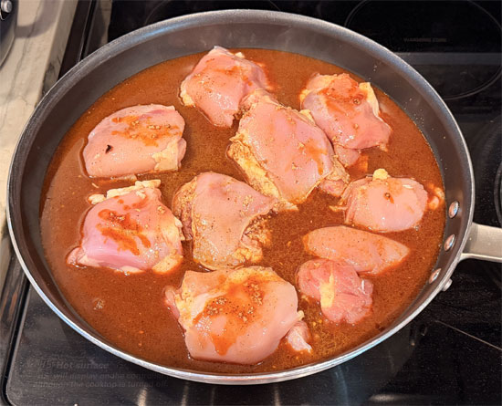 Pour the boiling water over the spice mixture and stir to combine. Pour this evenly over the chicken. 